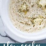 Slow cooker mashed potatoes creamy and delicious topped with melted butter and herbs.