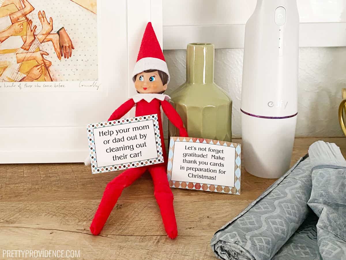 Elf on the Shelf with printable cards suggesting good deeds.