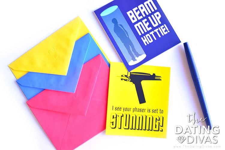 Star Trek themed valentines - a blue card that reads 'beam me up hottie!' and a yellow one - "I see your phaser is set to stunning!" on a white surface.