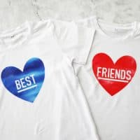 one t shirt with a blue heart that says "best" and one with a red heart that says "friends"