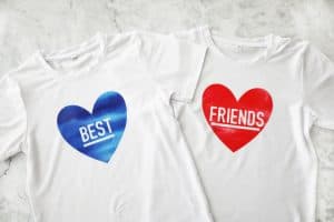 one t shirt with a blue heart that says "best" and one with a red heart that says "friends"