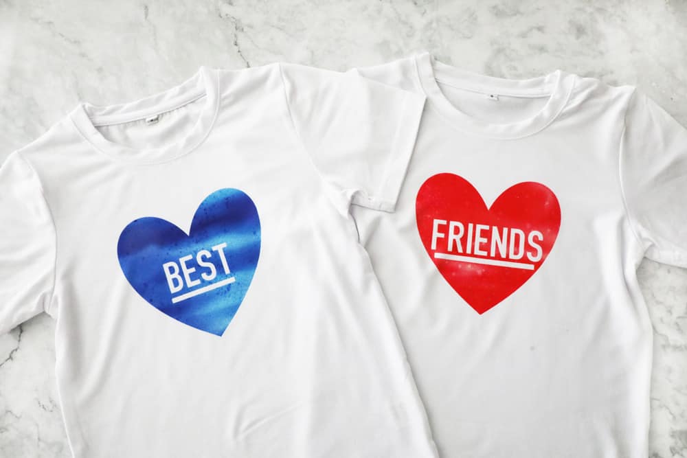 one t shirt with a blue heart that says "best" and one with a red heart that says "friends" 