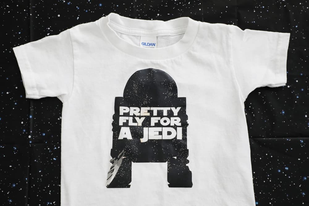 white t shirt with R2D2 sillouette with the words "pretty fly for a jedi" 