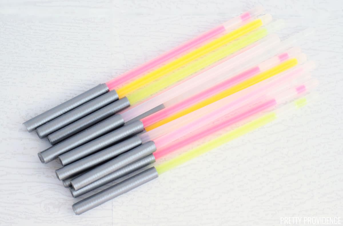 Glow sticks with duct tape wrapped on the bottom, light sabers for Star Wars Valentines.