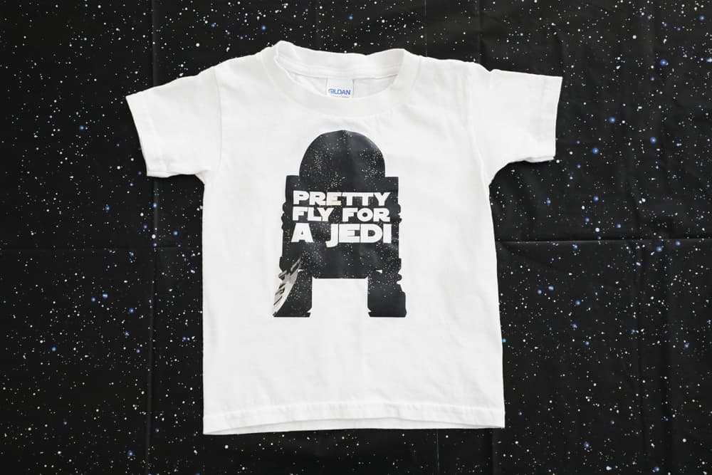 white t shirt with R2D2 sillouette with the words "pretty fly for a jedi" 
