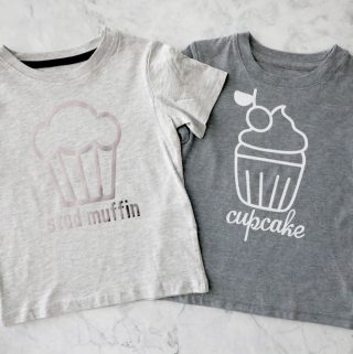two grey t shirts next to each other, one says "stud muffin" one says "cupcake"