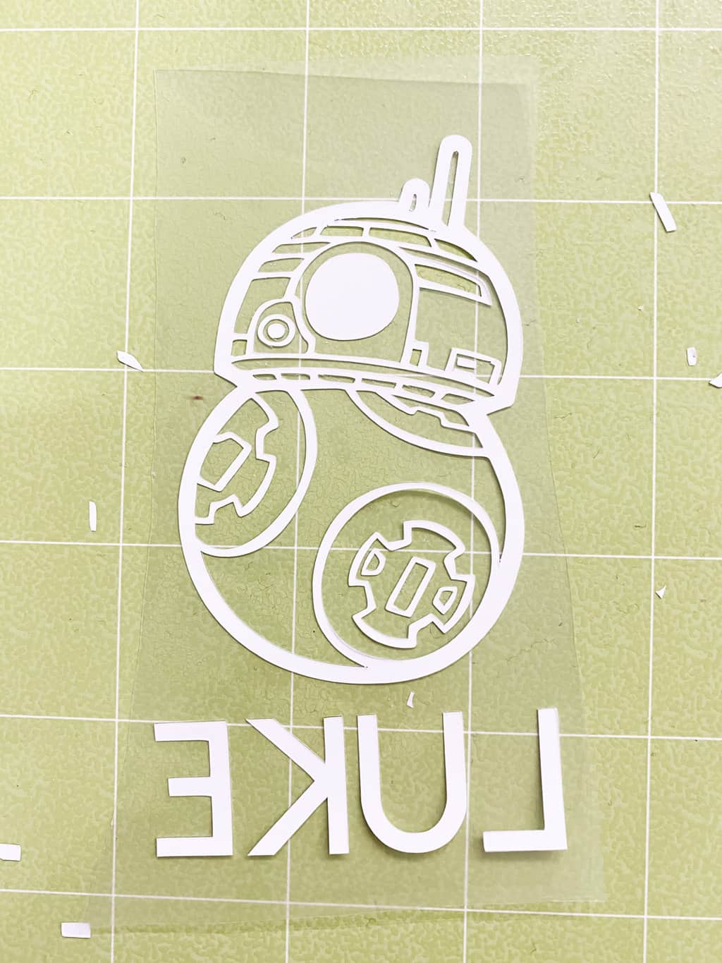 weeded iron on bb8 on a green cricut cutting mat