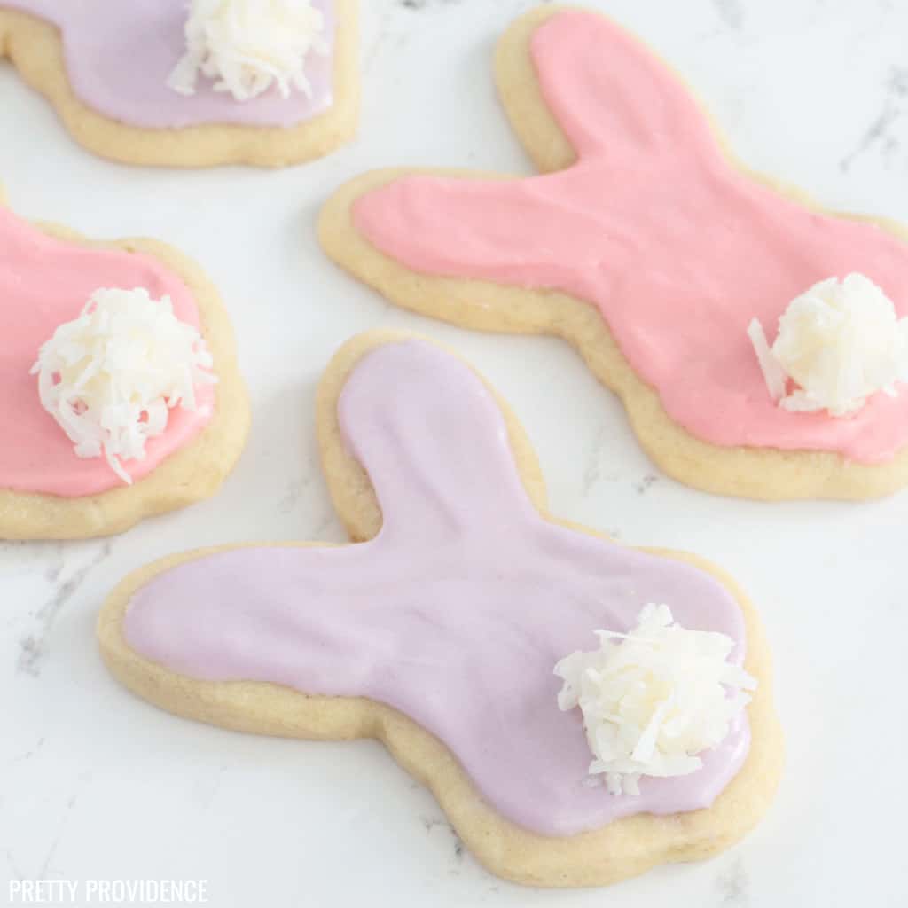Easter cookies shaped like bunnies with marshmallow tails.
