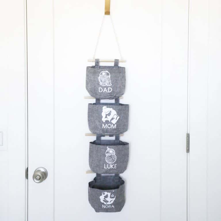 grey fish extender hanging in front of a white door