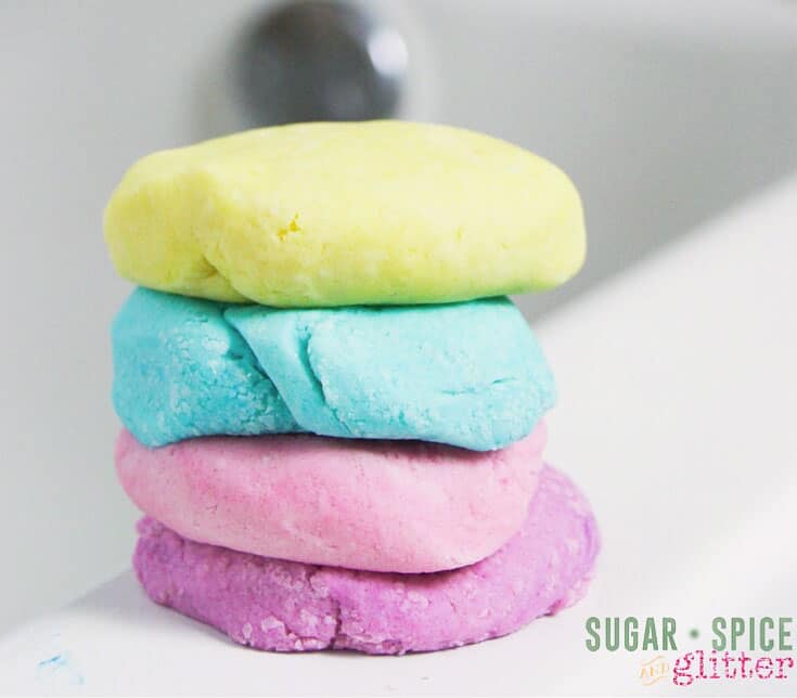 4 playdough soap colors stacked on side of bathtub
