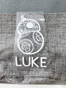 white iron-on bb8 on top of a grey fish extender bag