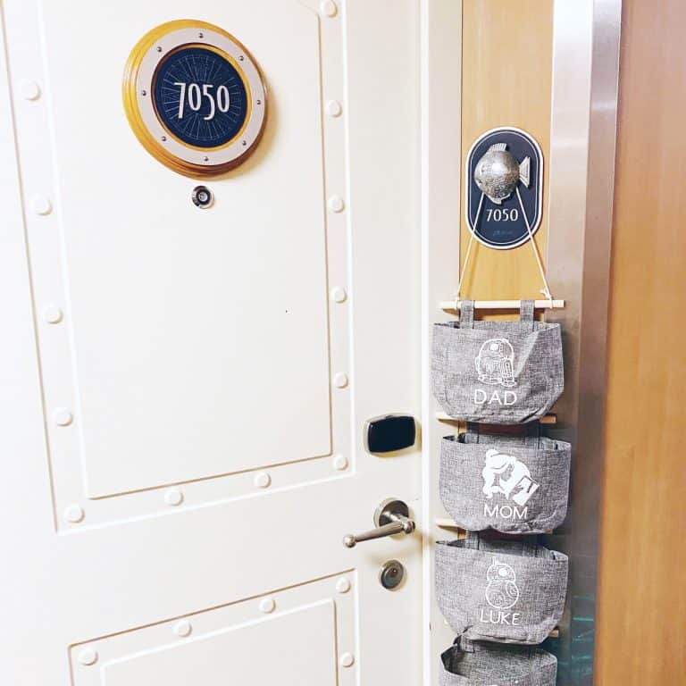 fish extender hanging next to a stateroom door on disney cruise line