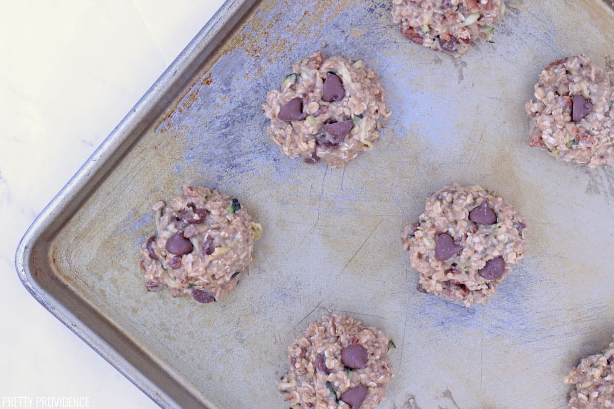 Breakfast cookie dough scooped onto cookie sheet.