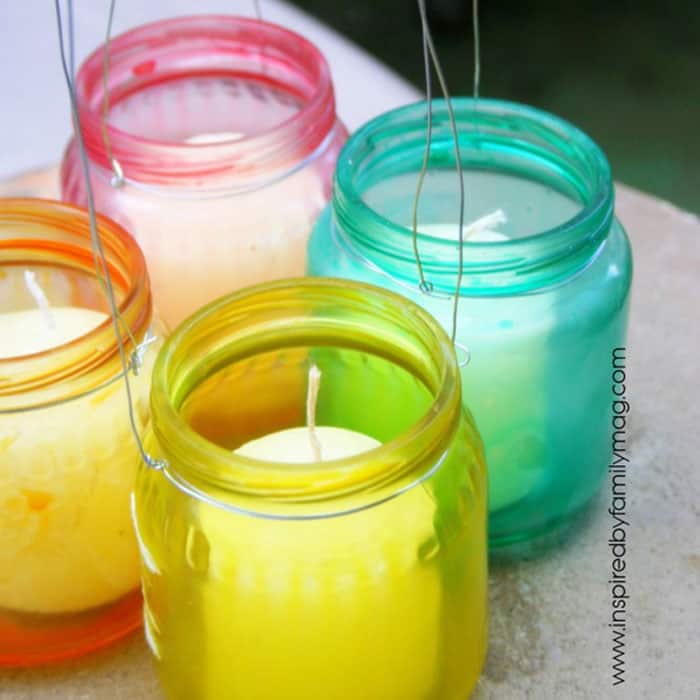 colorful dyed glass jars with candles in them