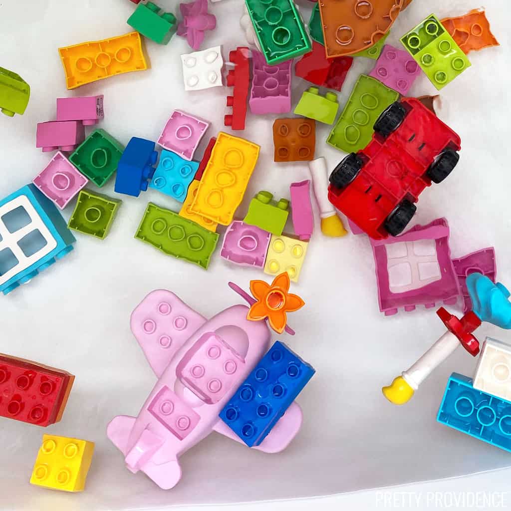 Bathtub with water and lego duplos floating in the water - great toddler bath activity