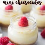 mini cheesecake in a jar with a raspberry on top and text overlay for pinterest