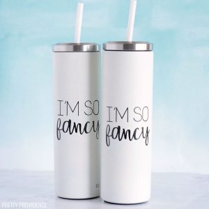 Two personalized yeti tumblers, white with black tumbler decal with Cricut vinyl