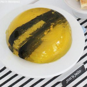 stapler in Jello molded on a white plate with label "Jim's Jello' for The Office themed party