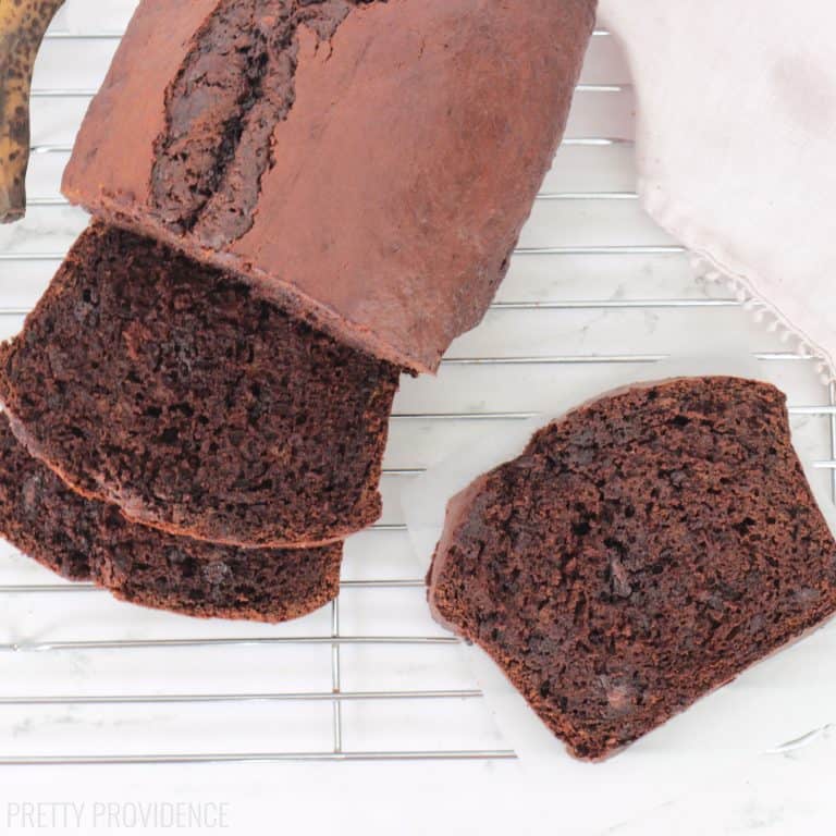 Chocolate banana bread sliced on a cooling rack