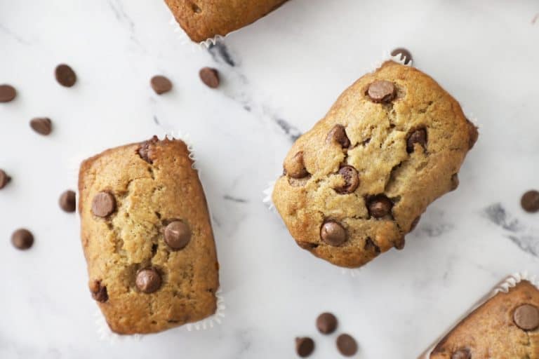 two banana bread mini loaves on a granite countertop