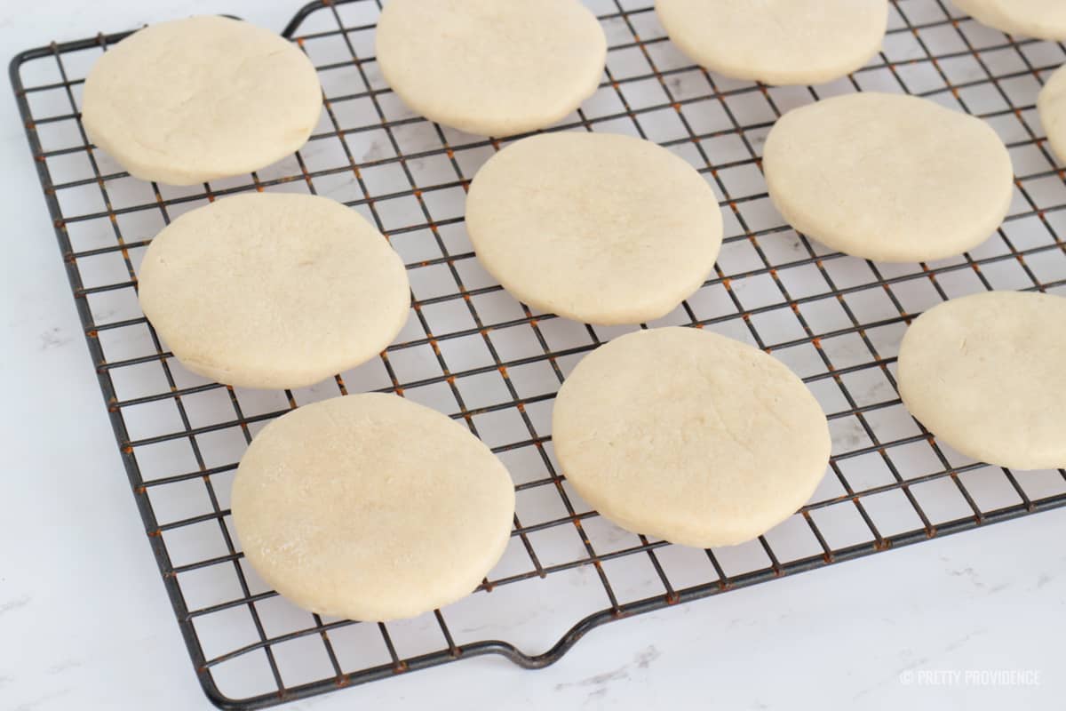 Soft round sugar cookies on a cooling rack