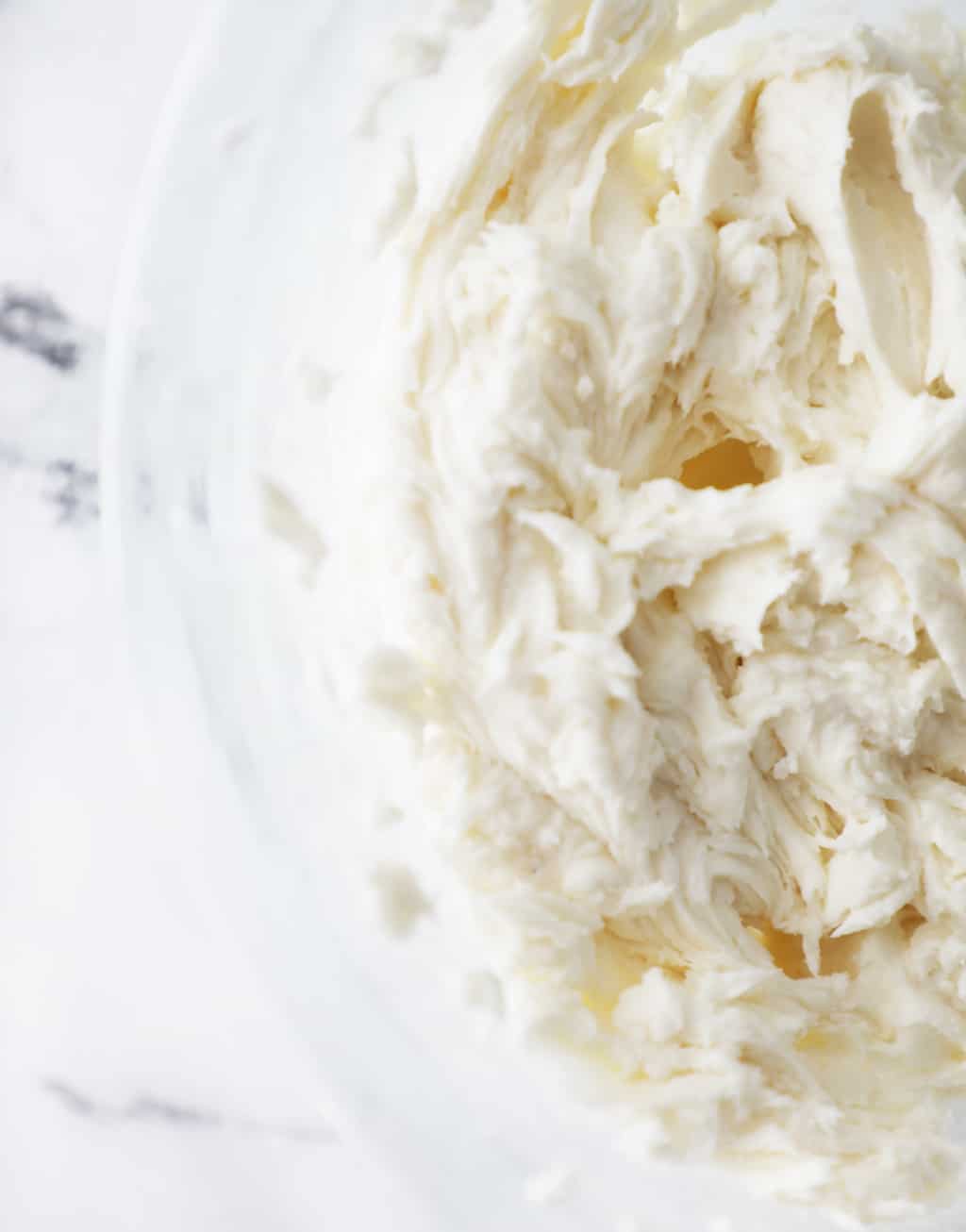 cream cheese frosting made with Truvia confectioners in clear bowl