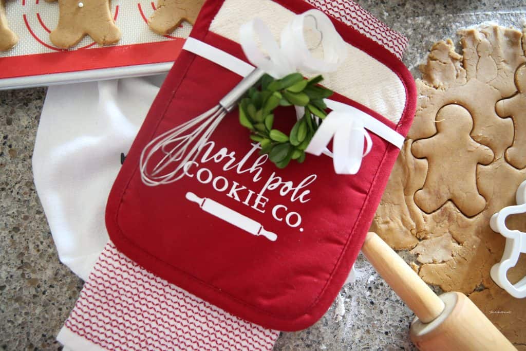 Baking gift idea, cookie dough and an oven mitt that says "north pole cookie co."