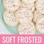 soft sugar cookies on a plate with white frosting and sprinkles