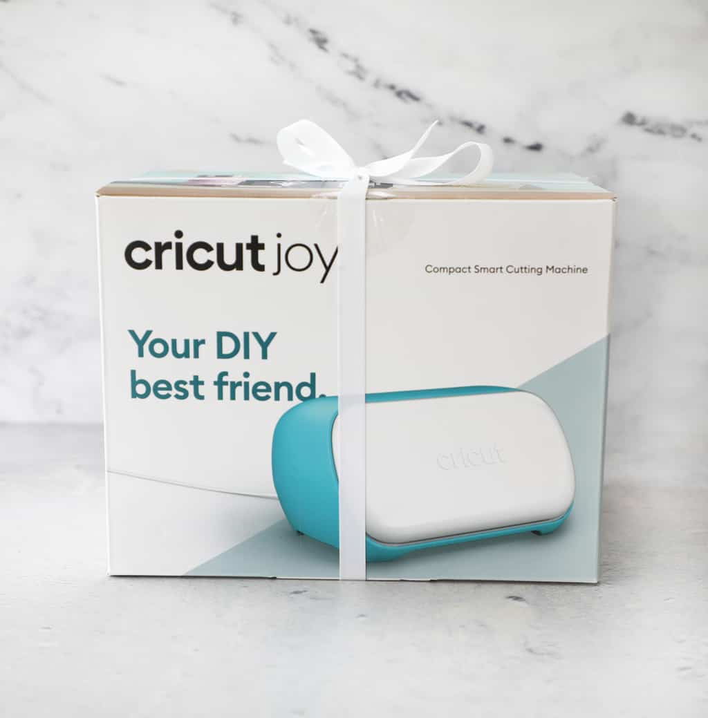 Cricut Joy box on top of a cement counter and a granite background