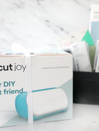 a Cricut Joy in the machine with supplies in the background