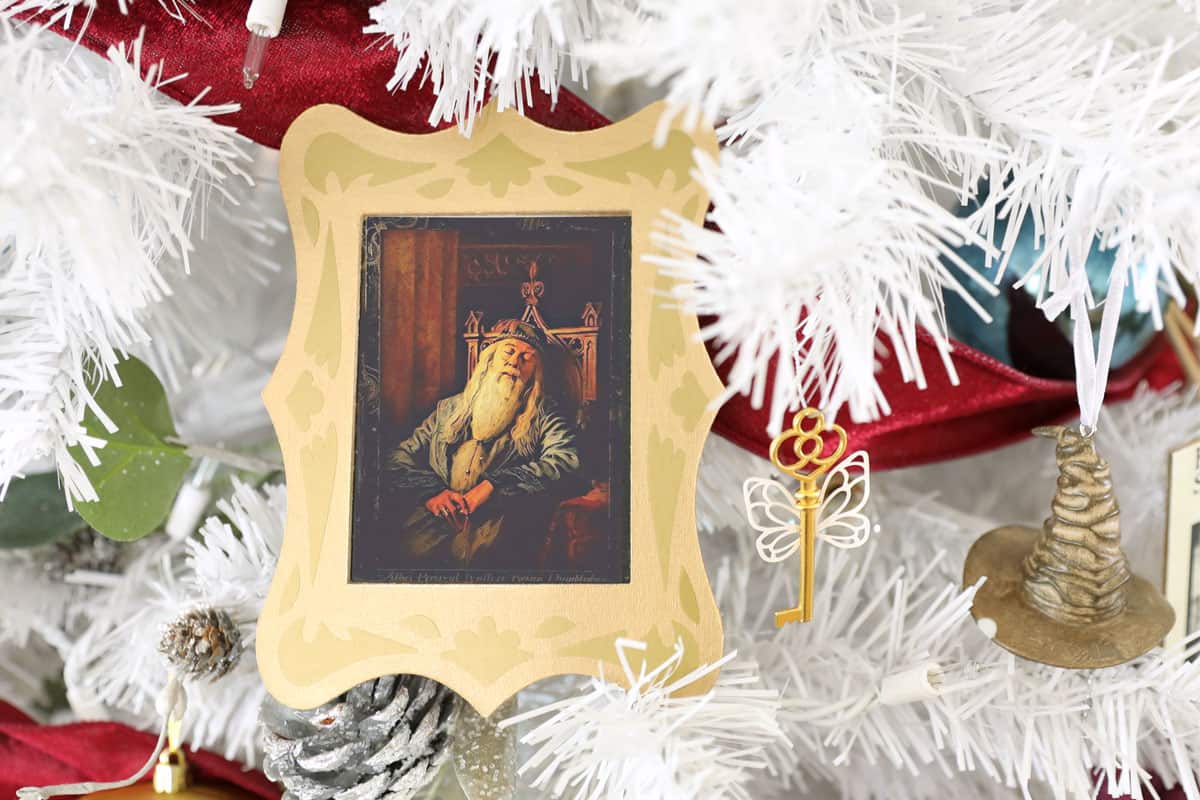 Dumbledore sleeping portrait in gold frame Christmas ornament on white tree