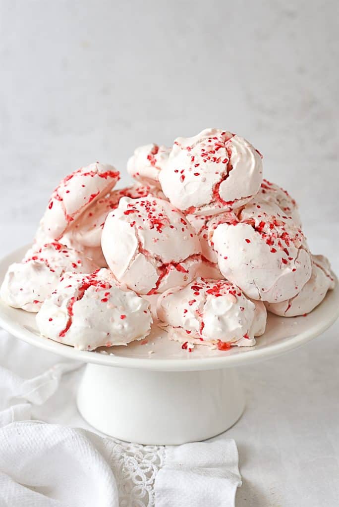 Peppermint White Meringues on a white cake stand