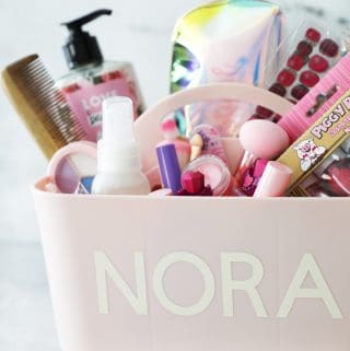 pink makeup caddy with the name Nora on it
