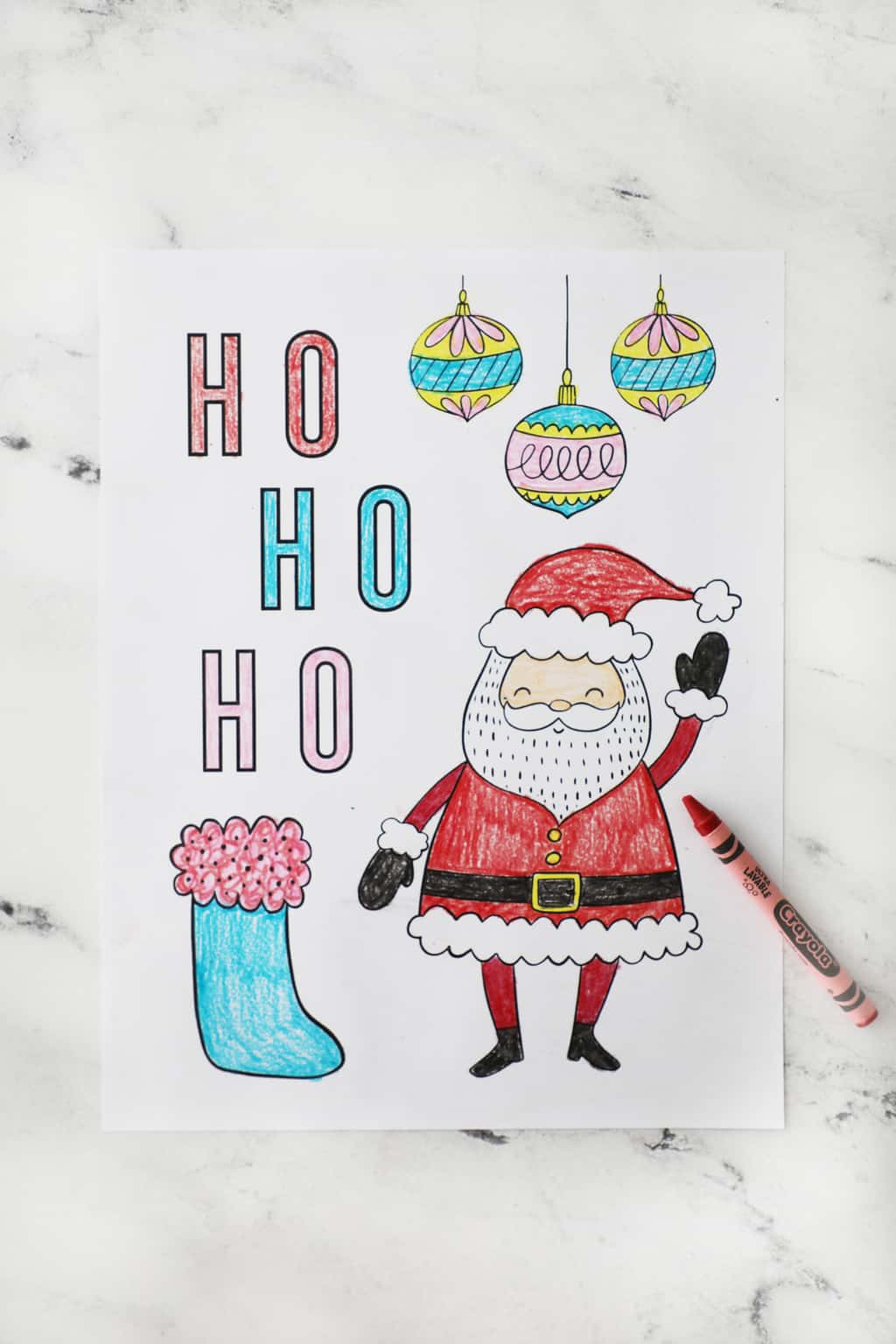 santa coloring page with the words "ho ho ho" and a stocking