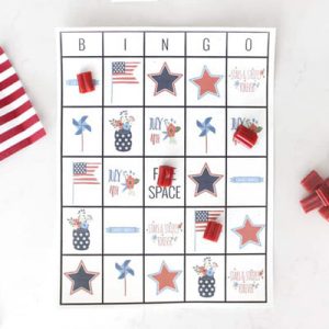 A Fourth of July themed bingo card with red licorice as candy markers.