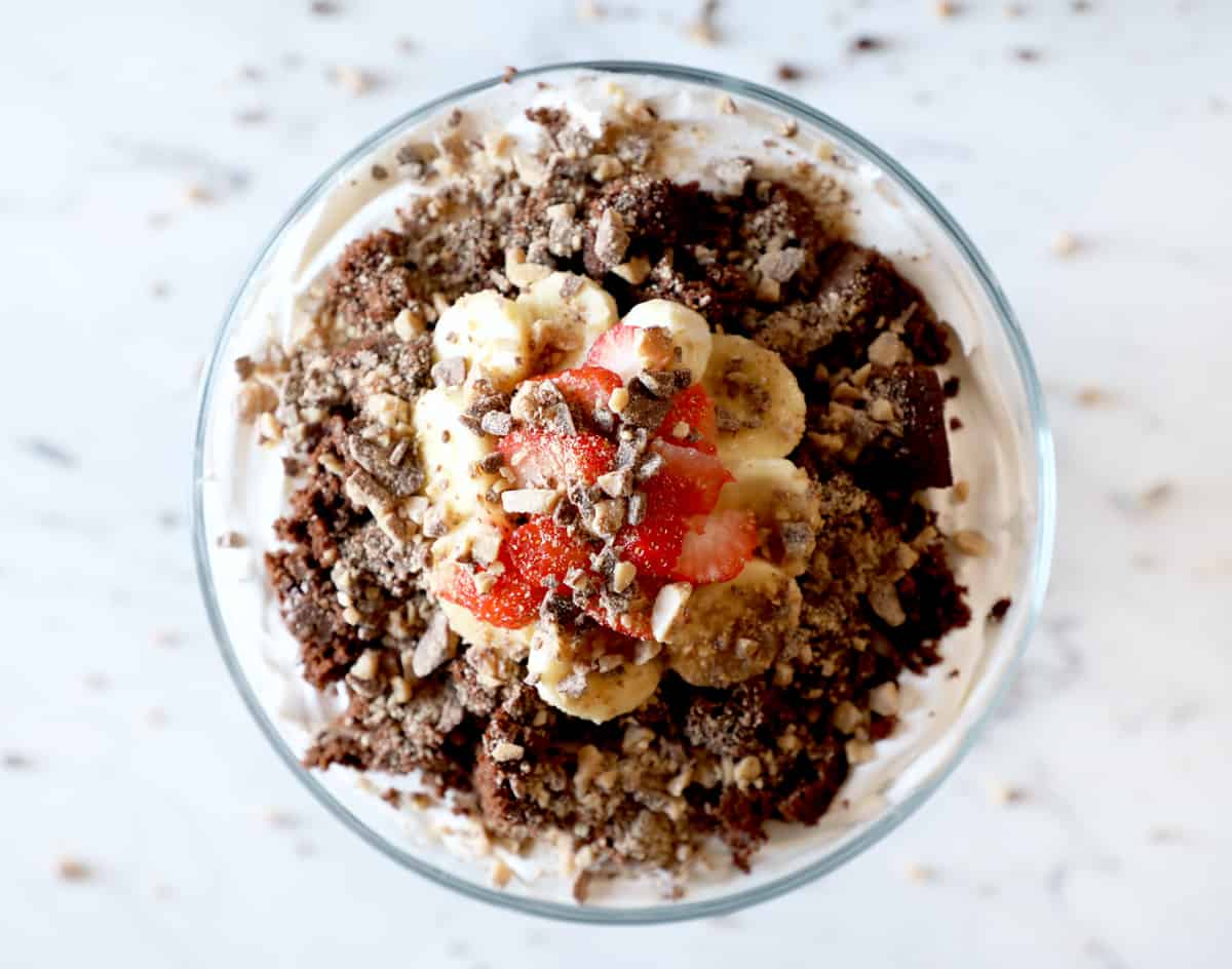 birds eye view of a heath bar brownie trifle surrounded by crumbs