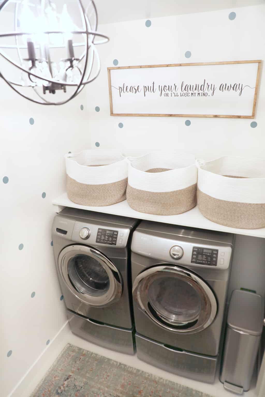 pretty black cage light in laundry room makeover