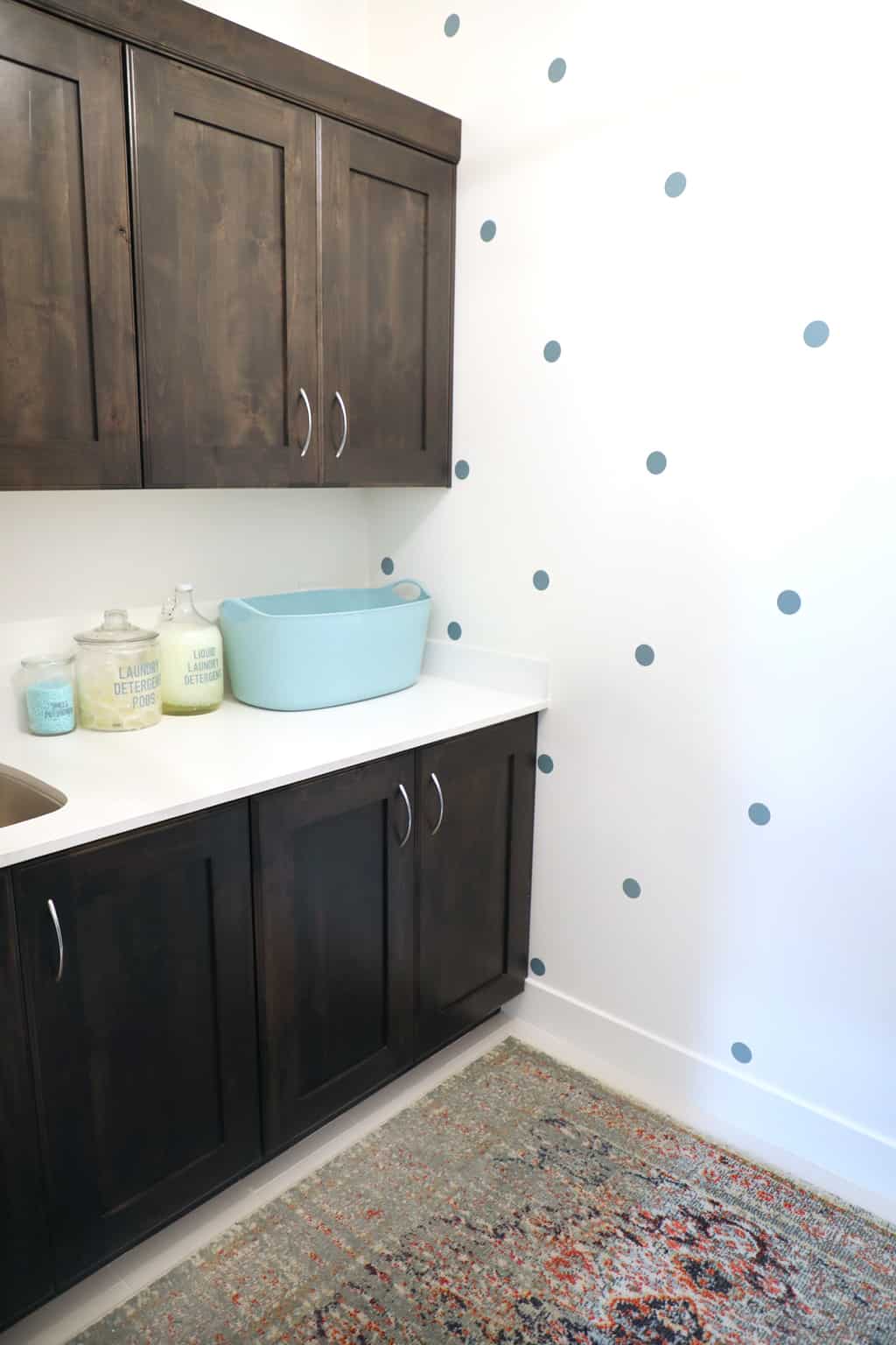 diy polka dot wallpaper in small laundry room