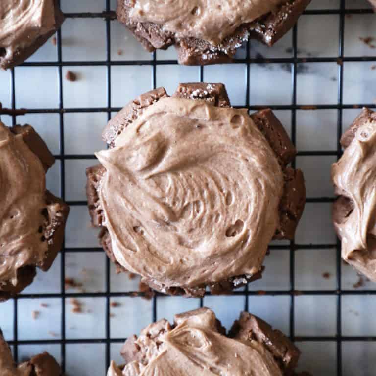 chocolate cookie with chocolate frosting on wire cooling rack
