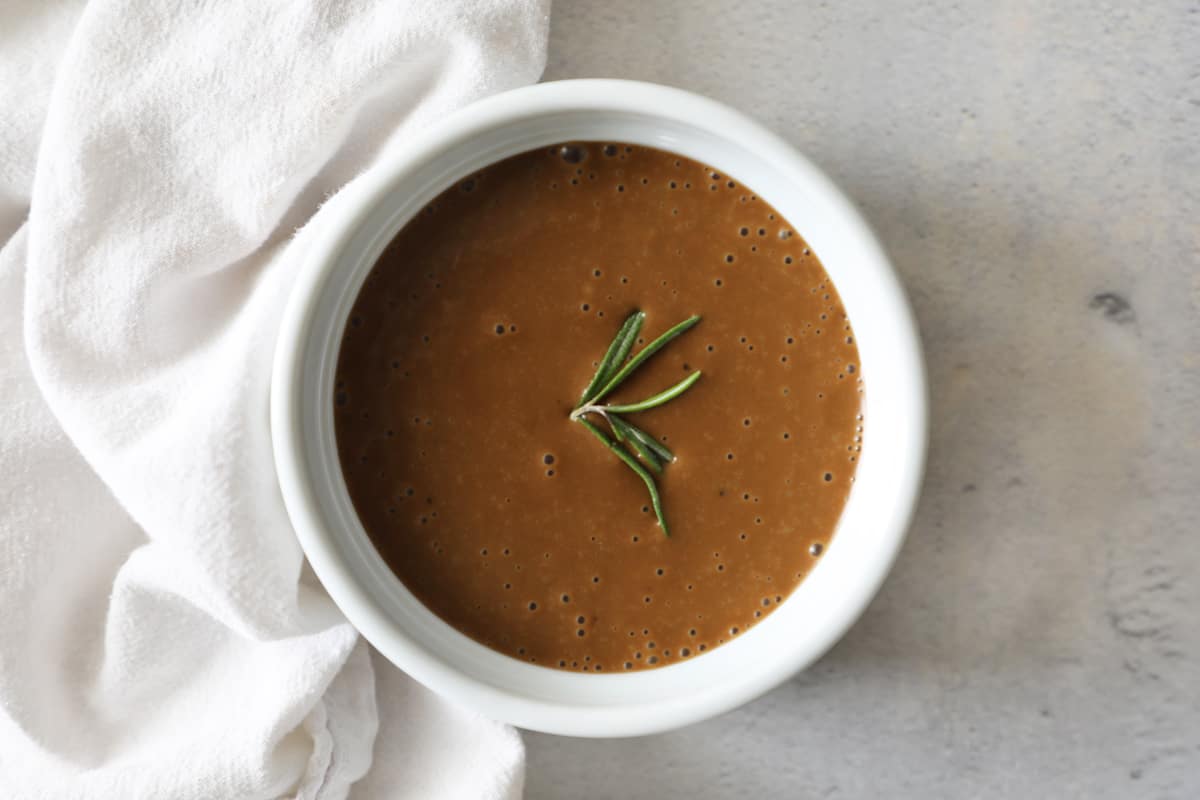 olive oil and balsamic vinegar bred dip on a concrete countertop