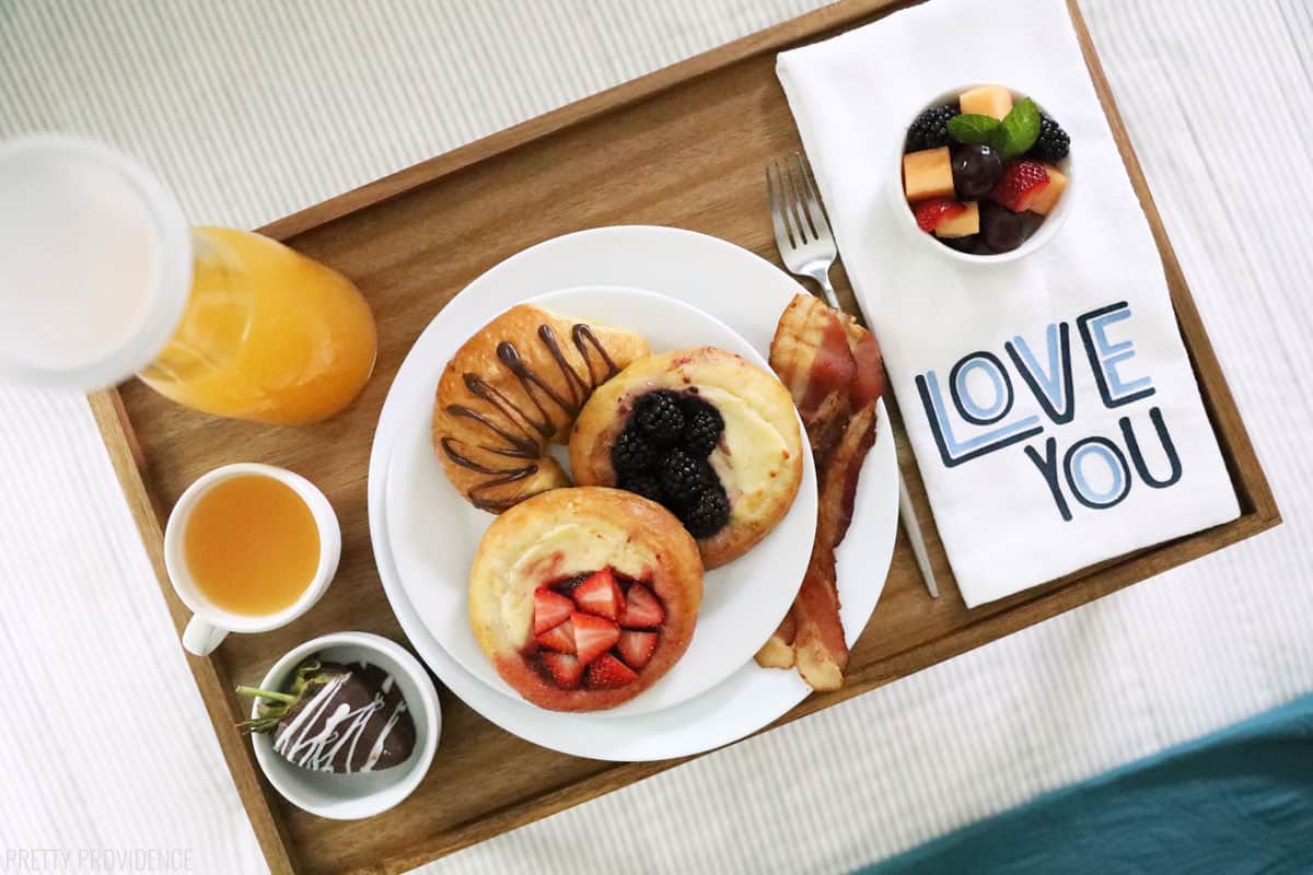 Breakfast in bed tray of food on bed with napkin