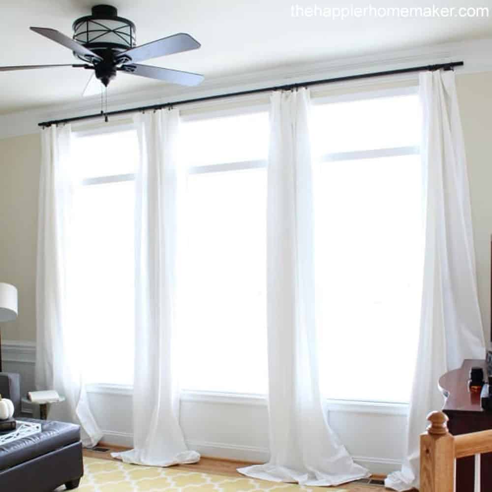 Black Curtain rod and white curtains Happier Homemaker