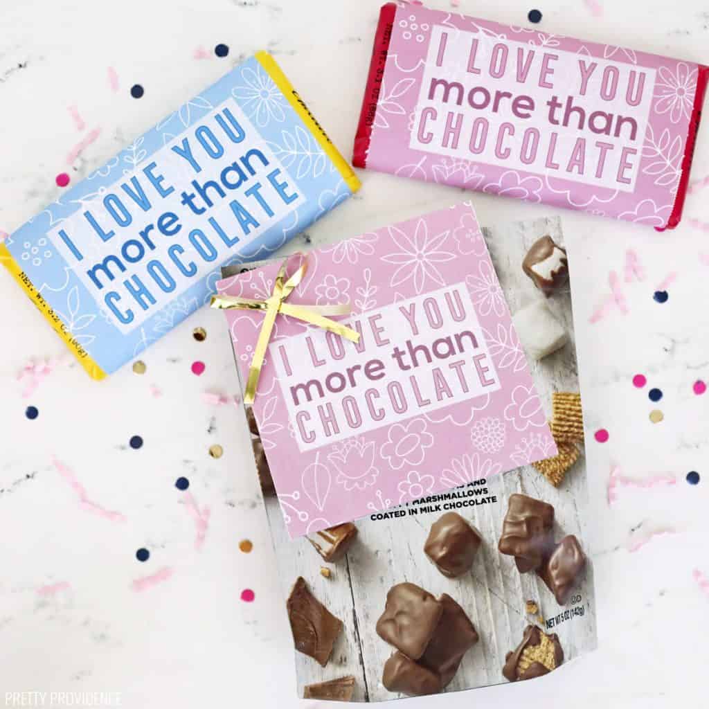 Two candy bars and a bag of chocolate candy with printable gift tags