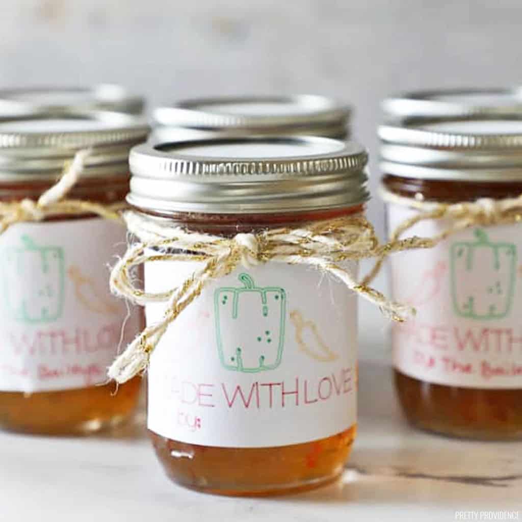 a small group of pint sized mason jars with diy labels