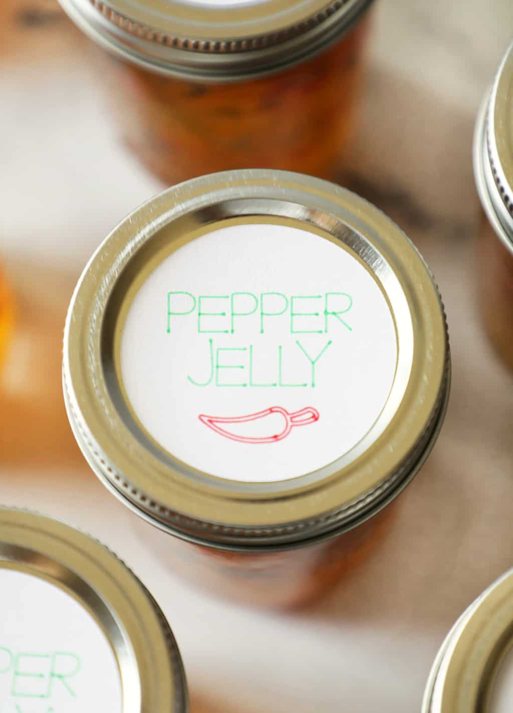 the top of a pint sized jar with a label that says "pepper jelly"