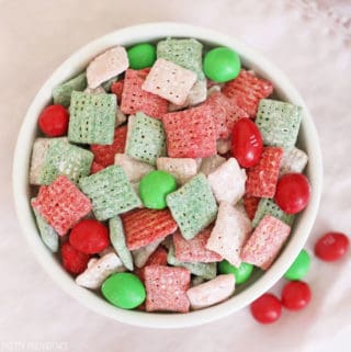 Red, green, pink and white muddy buddies with m&ms in it AKA reindeer chow