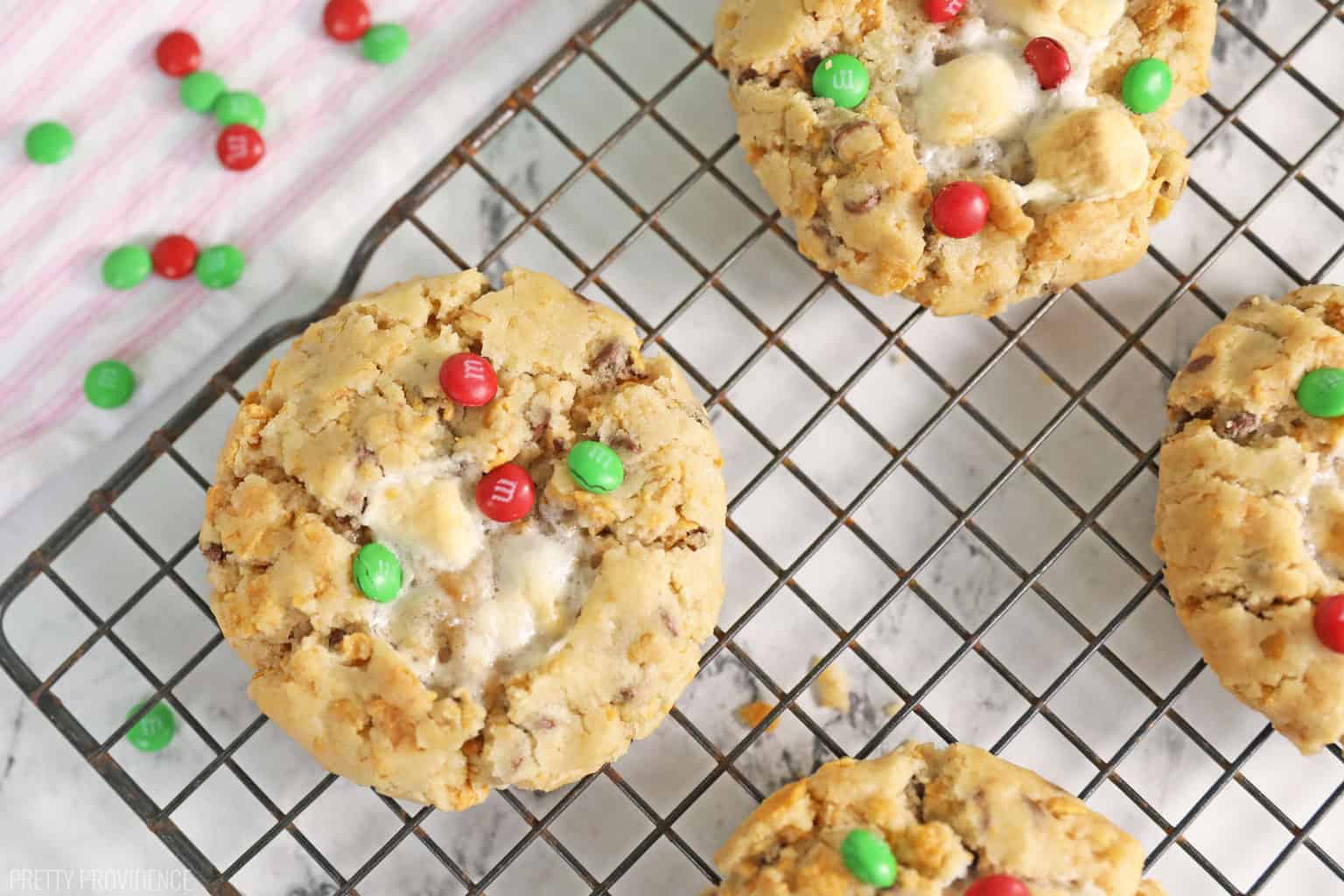 Christmas cookies with red and green m&ms on a cooling rack