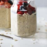 protein overnight oats topped with assorted berries with text for pinterest