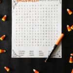 printable halloween game with orange pen on black backdrop