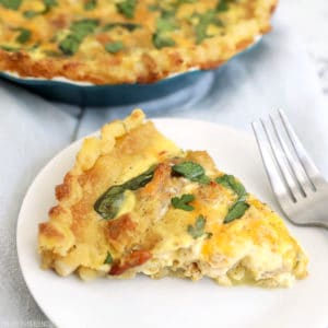 Leftover stuffing and turkey quiche on a white plate with fork